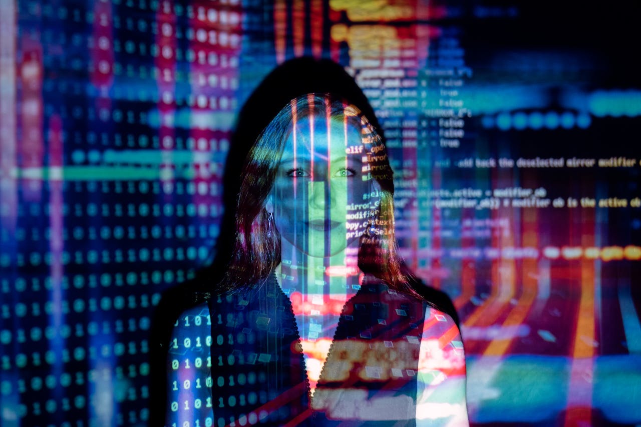 journey A woman with digital code projections on her face, representing technology and future concepts.